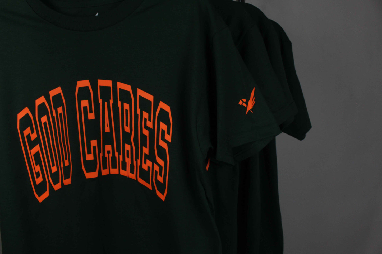 GC "God Cares" Glow-in-the-Dark Varsity Forest Green T-Shirt